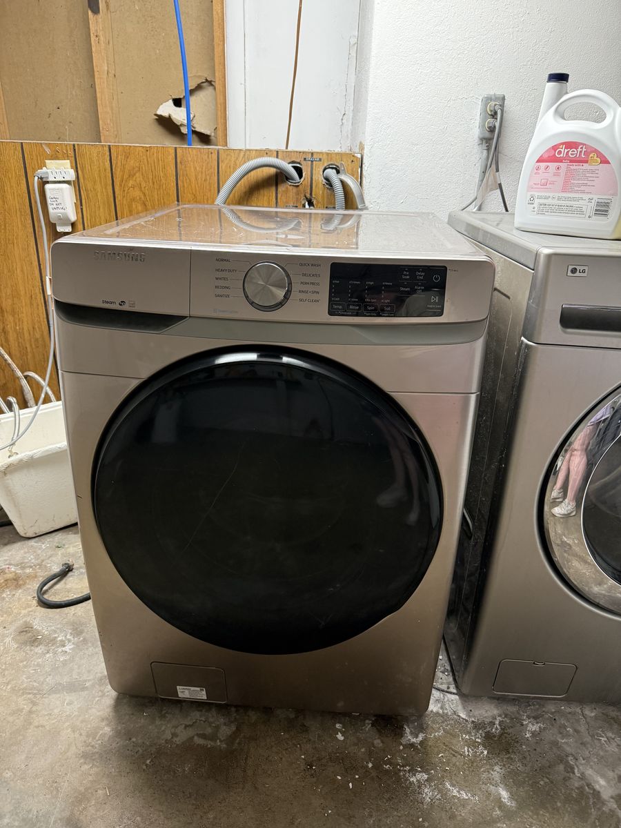 Samsung front-load washer and electric dryer set.