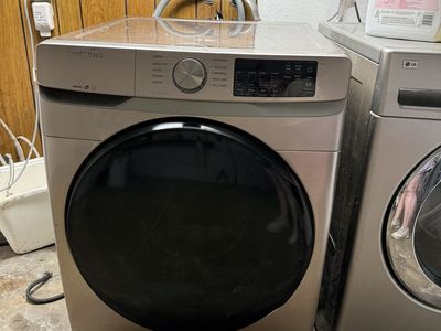 Samsung front-load washer and electric dryer set.