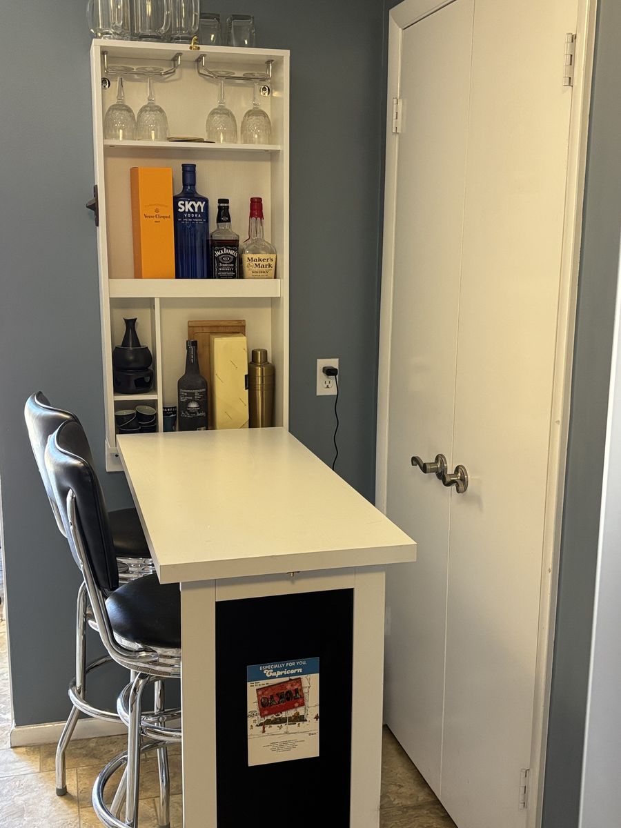 Fold up bar with two bar stools