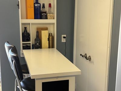 Fold up bar with two bar stools