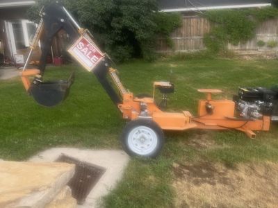 Mini toe behind backhoe
