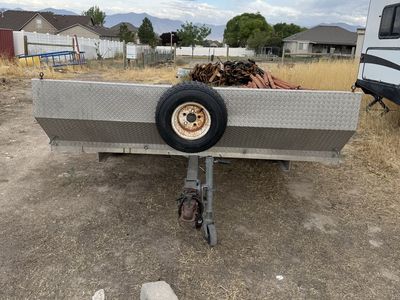 8’x10’ Featherlite aluminum open tilt deck utility trailer.