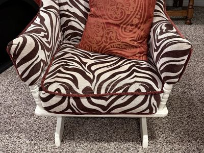 Zebra Print Rocking Chair with Rust Colored Trim + matching ottoman. Unique & Comfortable Seating