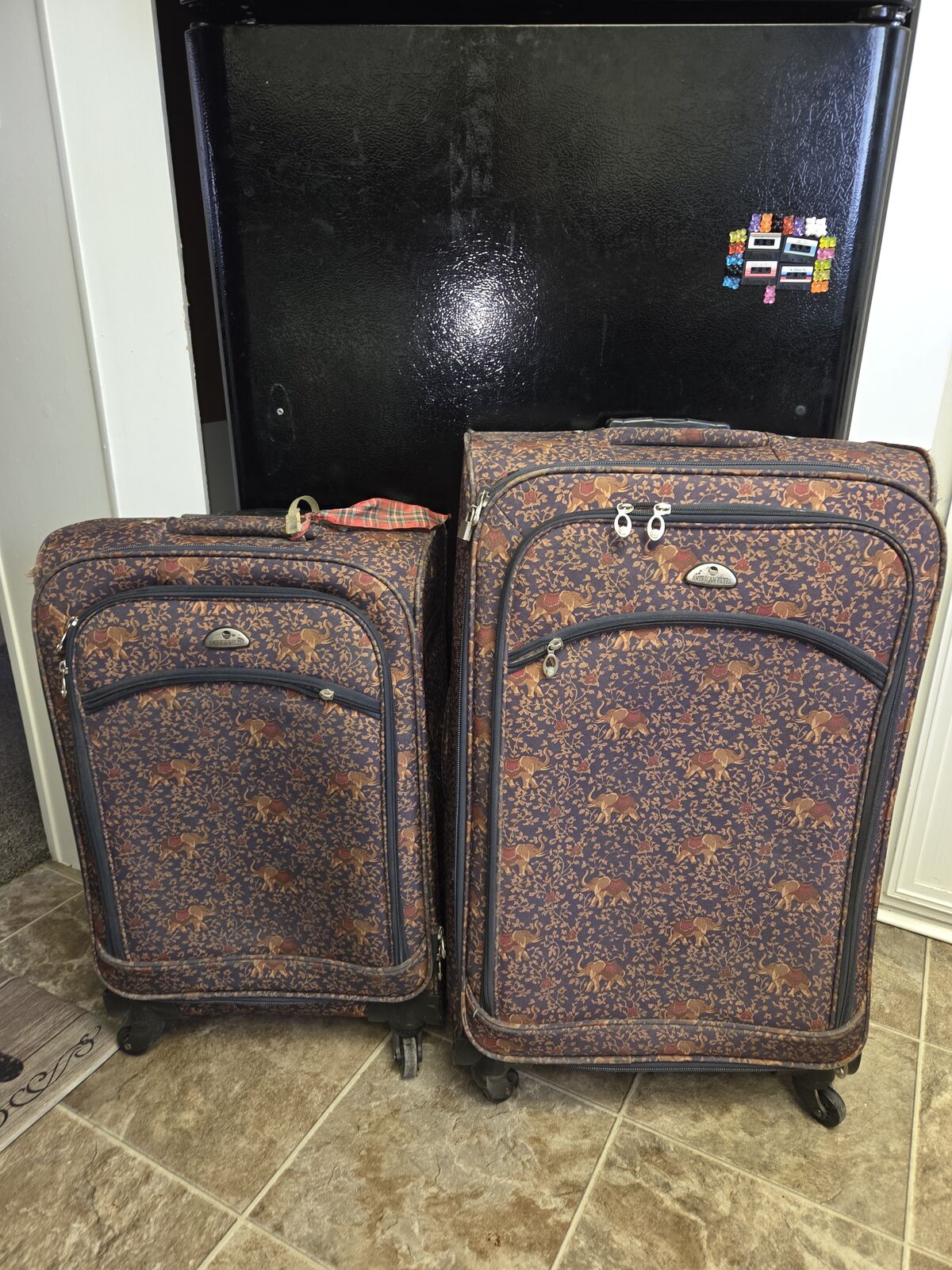 2 different sized Rolling suitcases $50