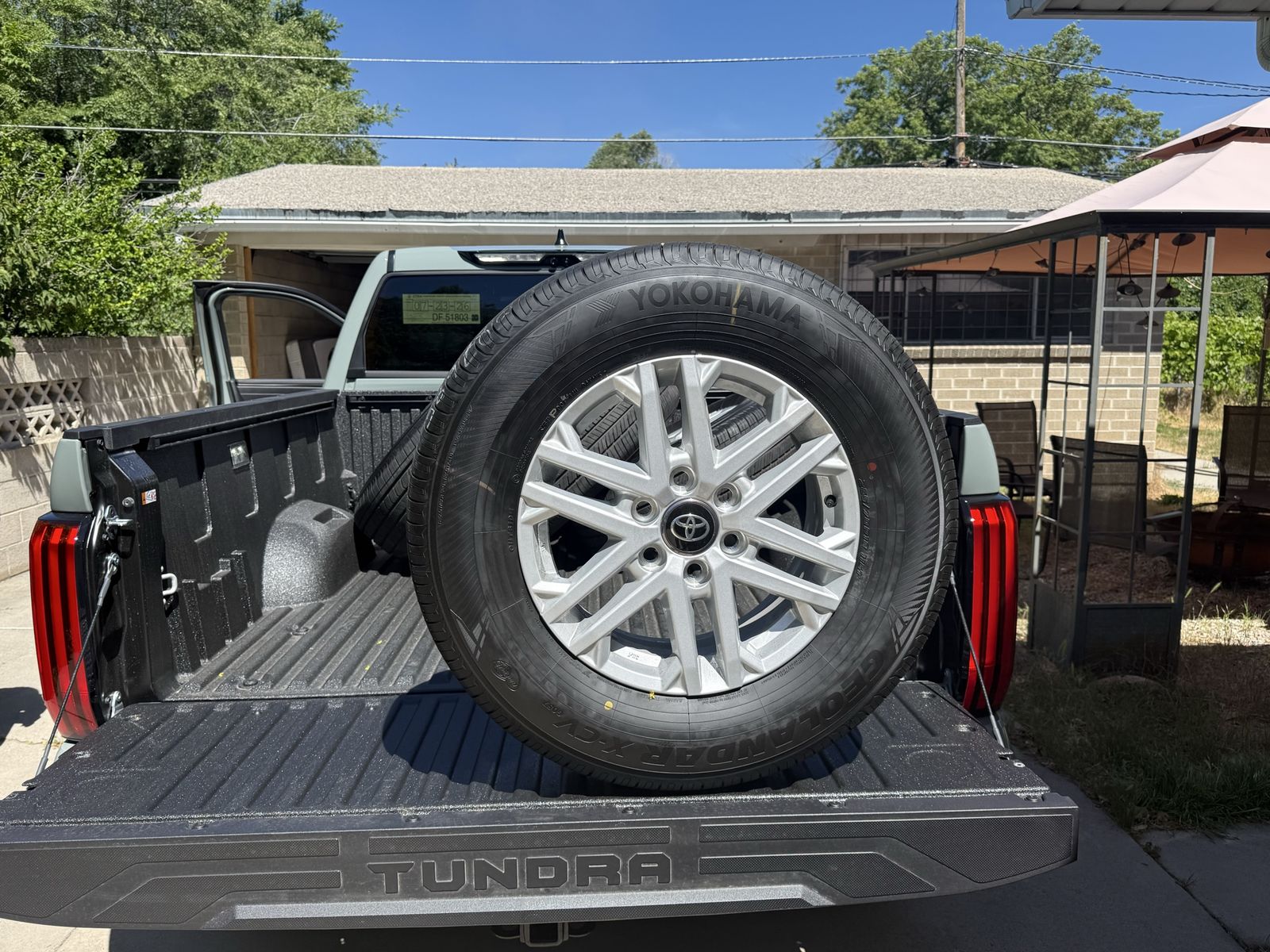 2026 Toyota Tundra OEM 18-inch takeoff wheels with Yokohama Geolandar X-CV 265/70R18 tires.