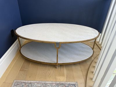 Marble and gold metal oval coffee table
