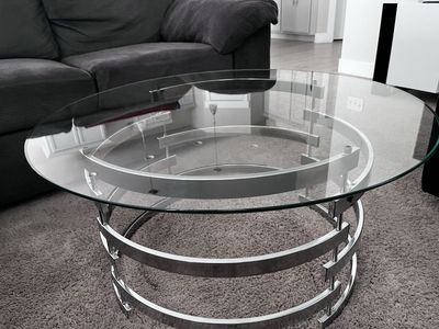 Glass coffee table with metal base