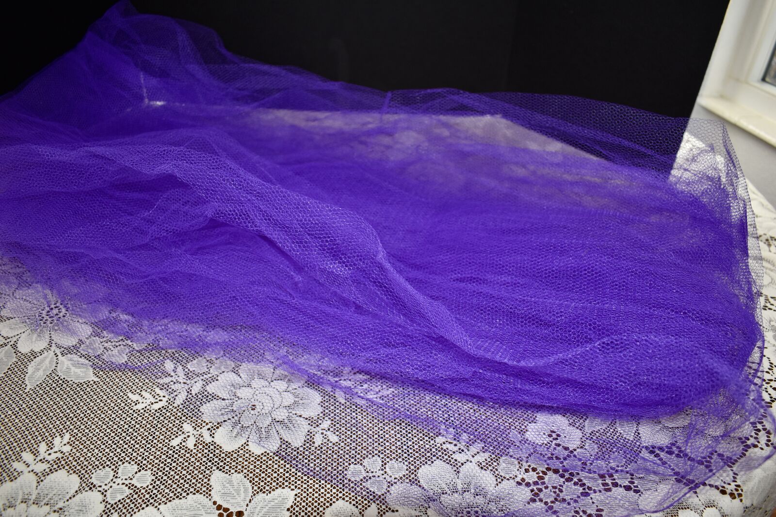 APPROX. 3 1/2 YARDS OF PURPLE NETTING THAT IS APPROX. 2 YARDS WIDE