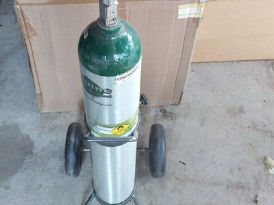 Oxygen tank half full with caddy