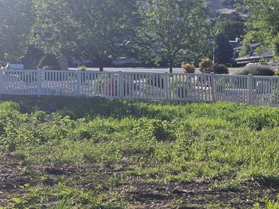 96 feet of semi-privacy vinyl fence, 4-foot, tan, gate