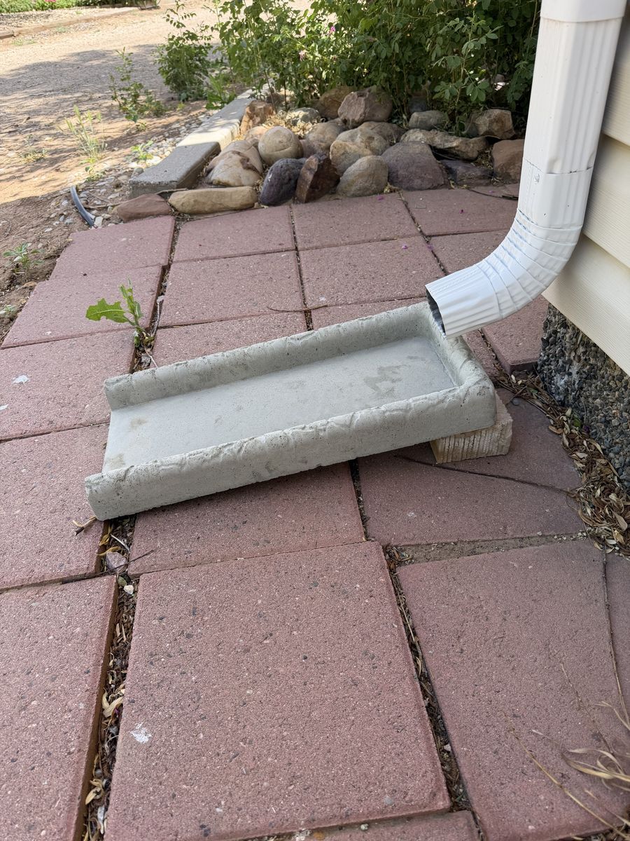 Rain gutter downspout splash block
