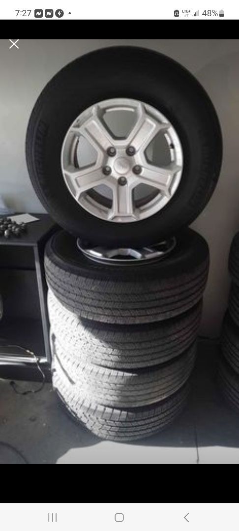 Set of 5 Jeep Wrangler rims and tires