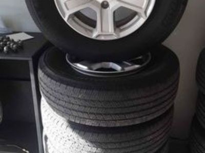 Set of 5 Jeep Wrangler rims and tires