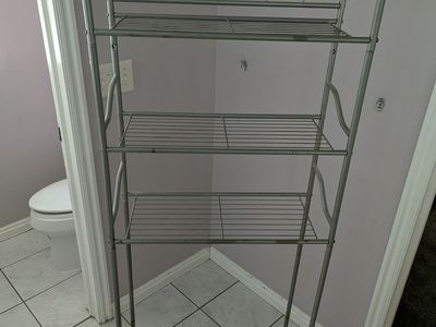 Storage shelf for above a toilet