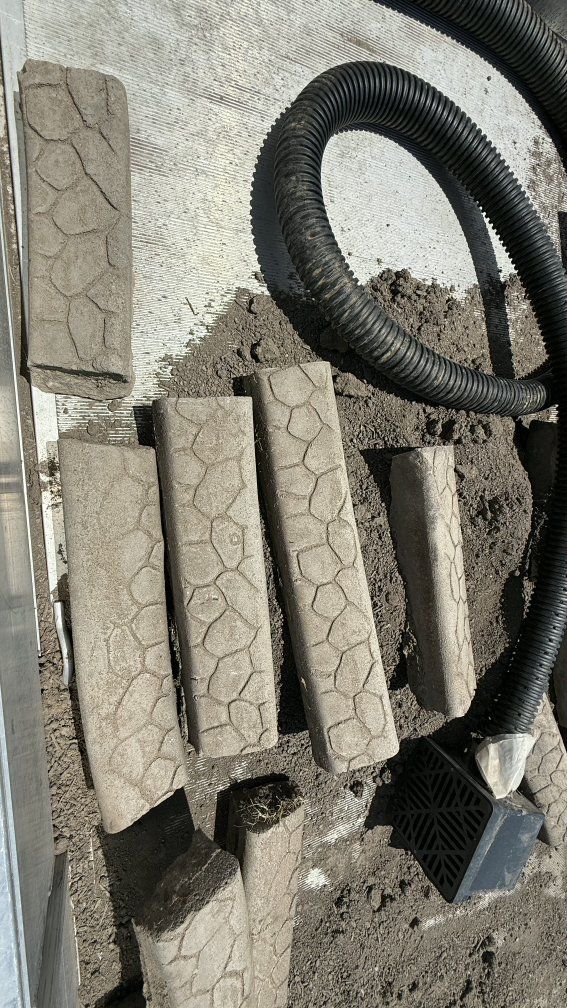 Cement stamped curbing. Good condition