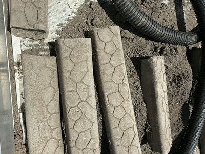 Cement stamped curbing. Good condition