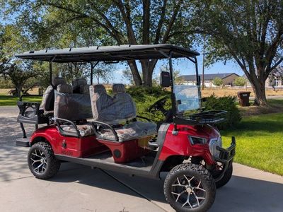 HQ100 Red Multi-Seater Golf Cart with Extended Roof and Custom Wheels