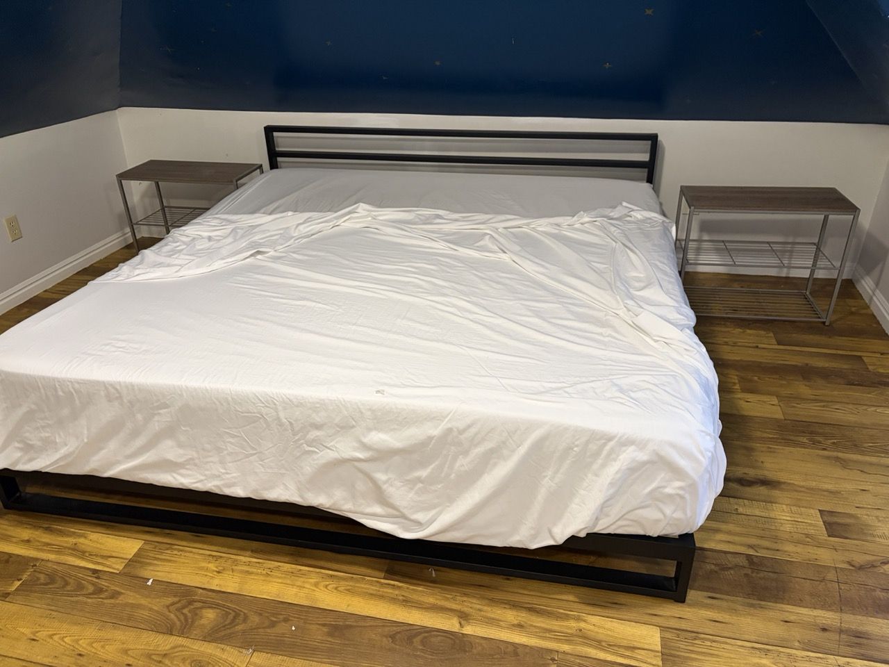 Beds, matresses, side tables near U