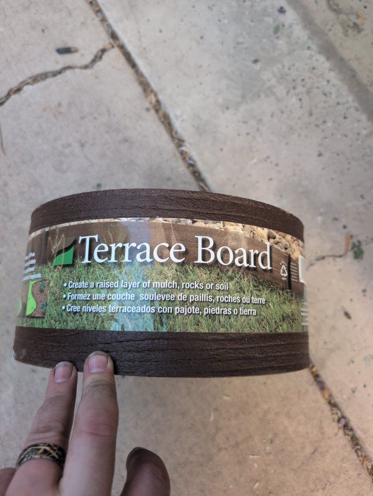 New Terrace board. 5" tall, 40 feet long with stakes
