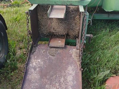 Small John Deere baler.