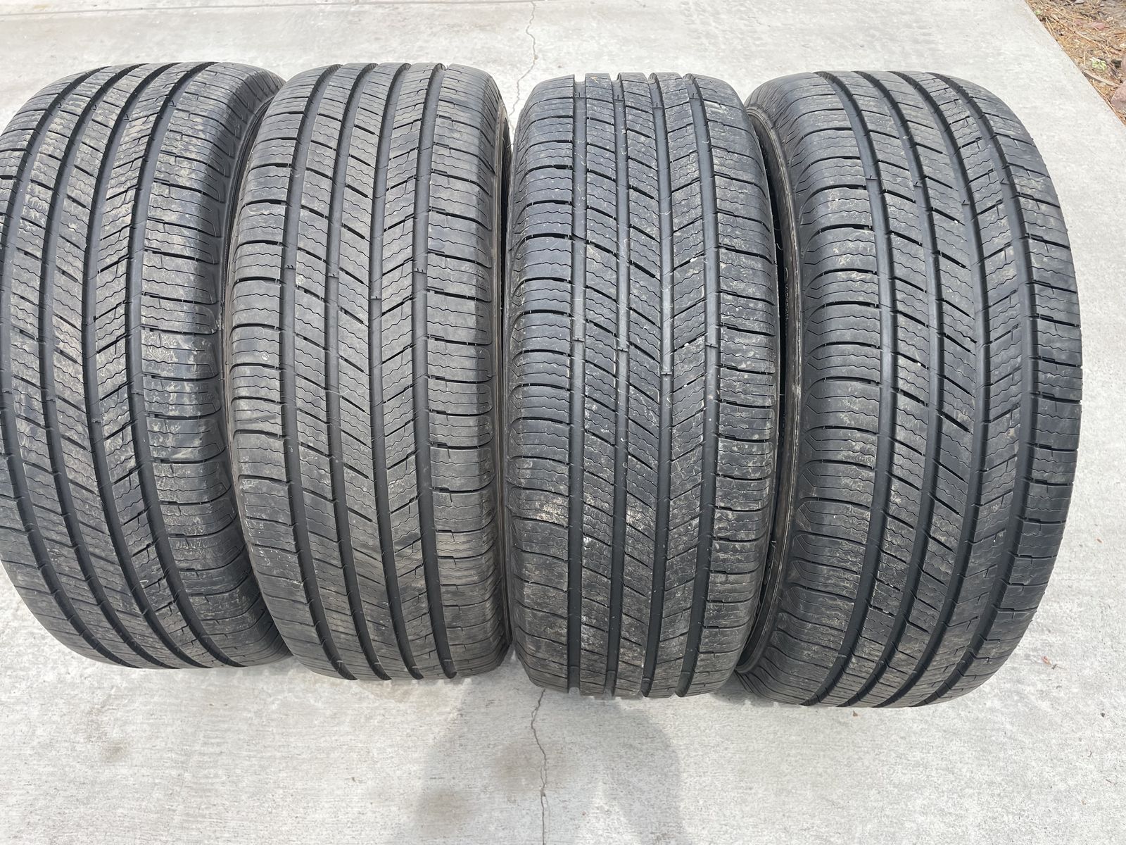 Michelin tires with more than 2/3 tread.  325X55X17 inch