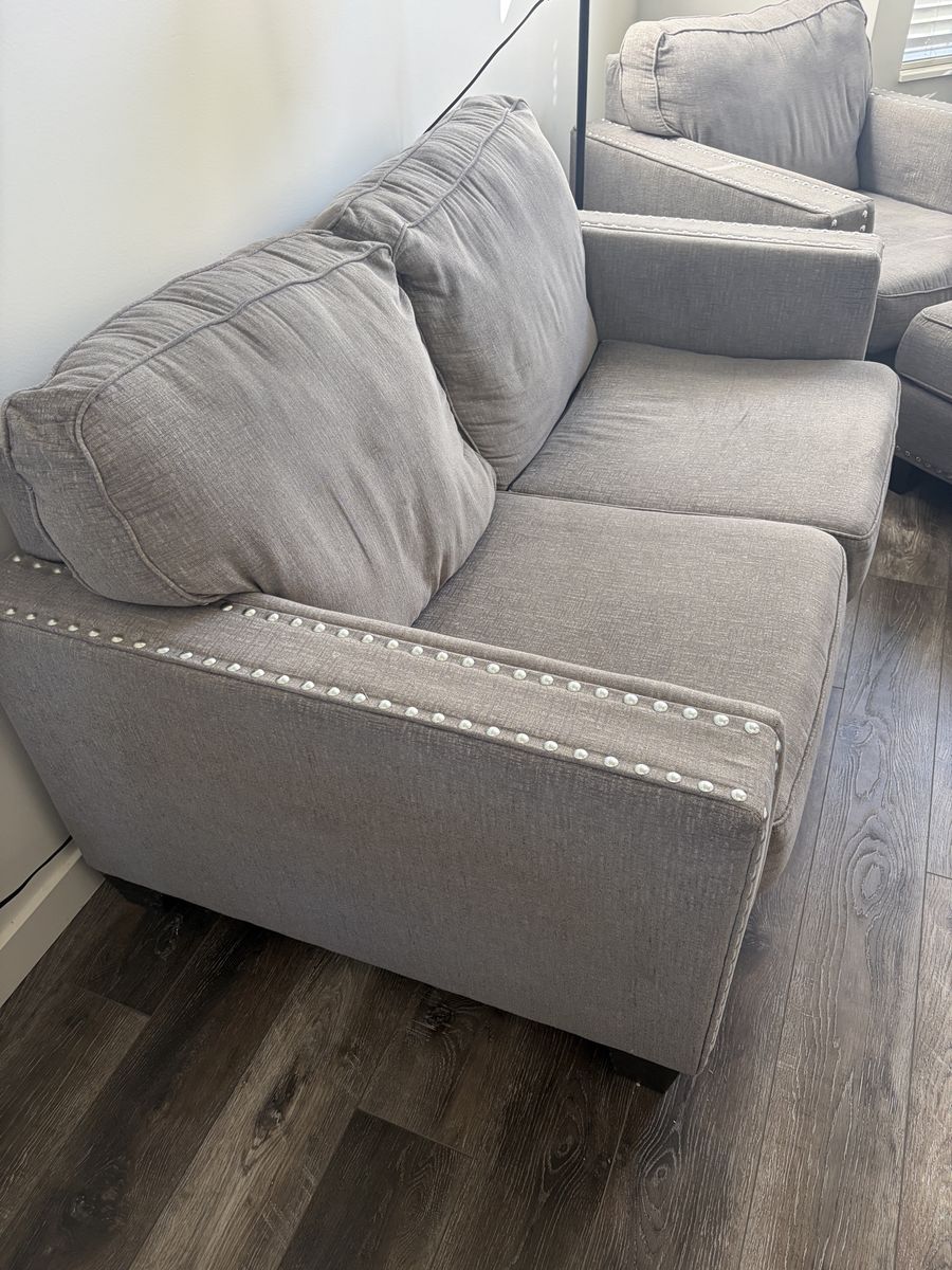 Gray Fabric Loveseat with Nailhead Trim