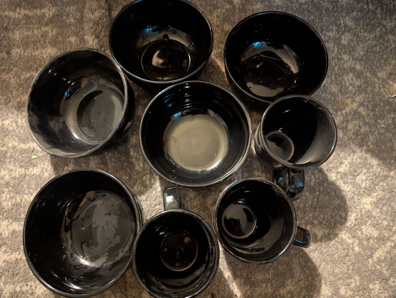 Black plates, cups and bowls