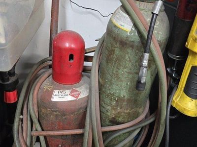 Oxy- Acetylene set w/dolly, hoses, regulator, tip.