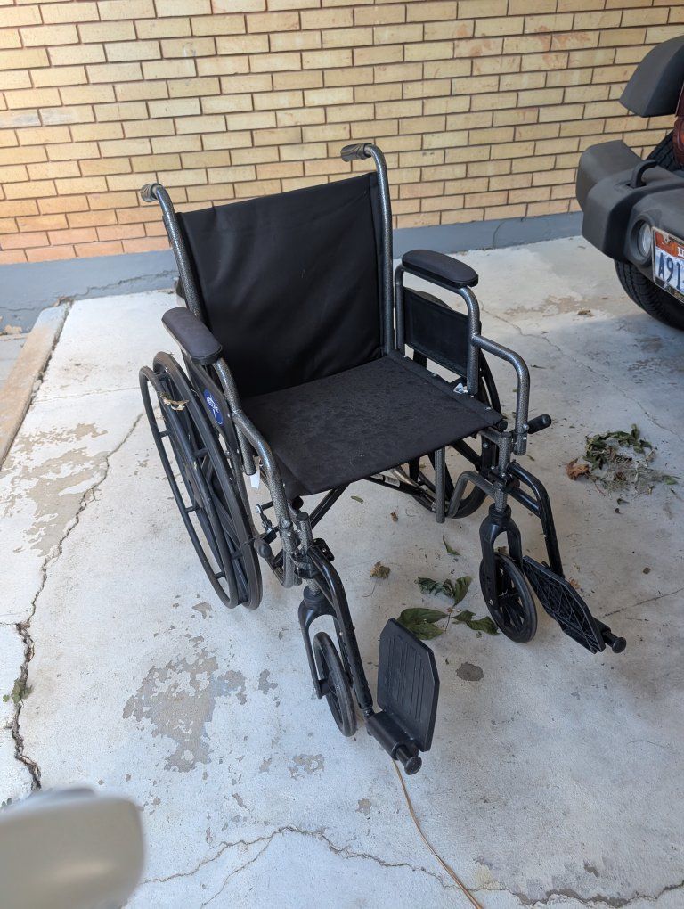 Medline Standard Wheelchair with Black Upholstery and Footrests $50 or OBO