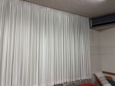 Very large sturdy curtains with black outs included.