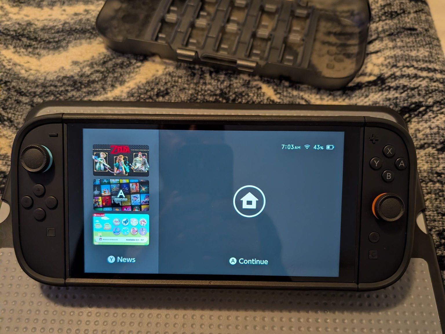 Nintendo Switch Console with Dbrand kill switch case.