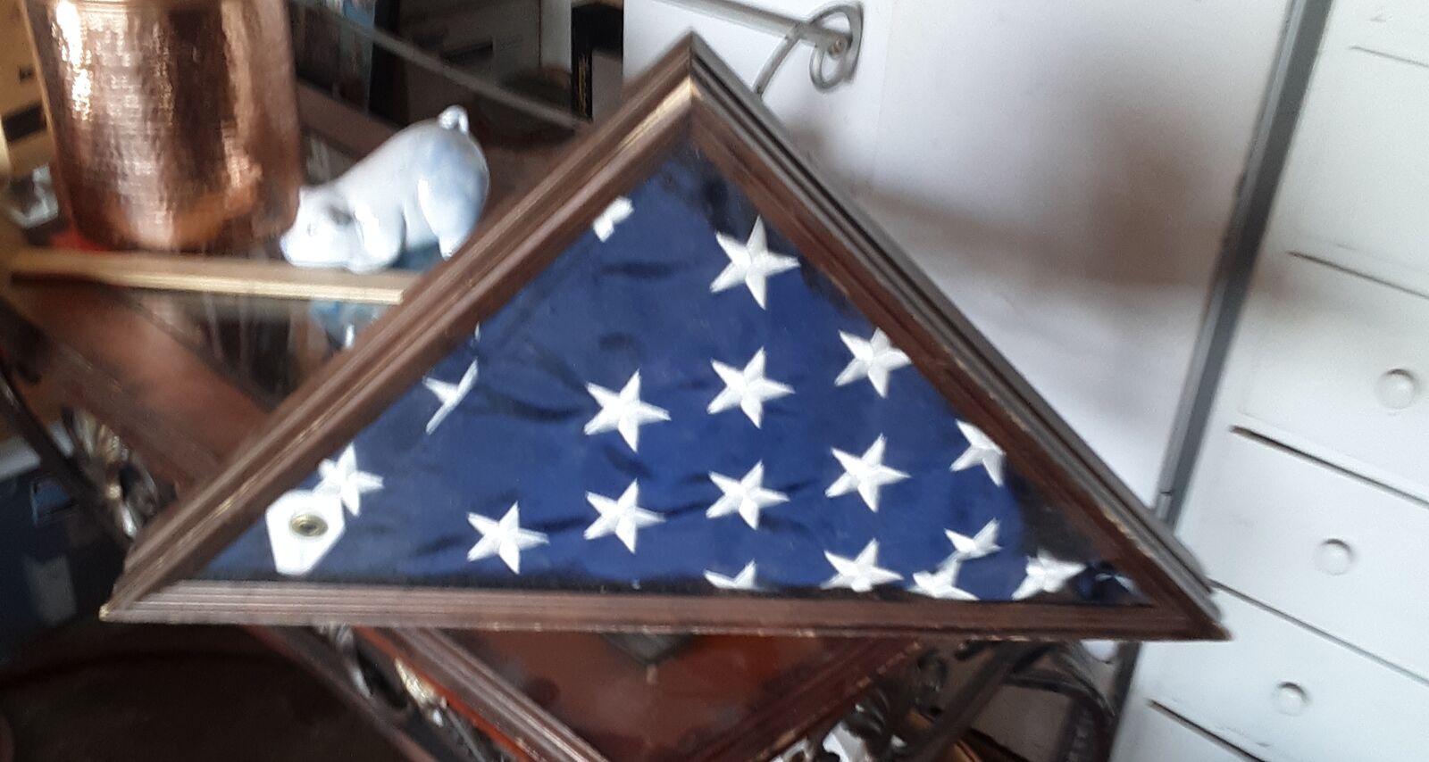 American flag in wooden triangle box