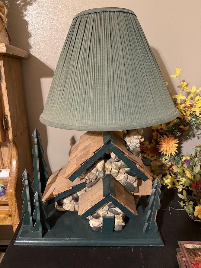 Rustic Cabin Lamp with Stone Base and Green Pleated Shade.