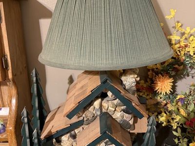 Rustic Cabin Lamp with Stone Base and Green Pleated Shade.