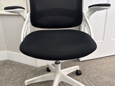 Black Mesh Ergonomic Office Chair with White Base and Flip-Up Arms