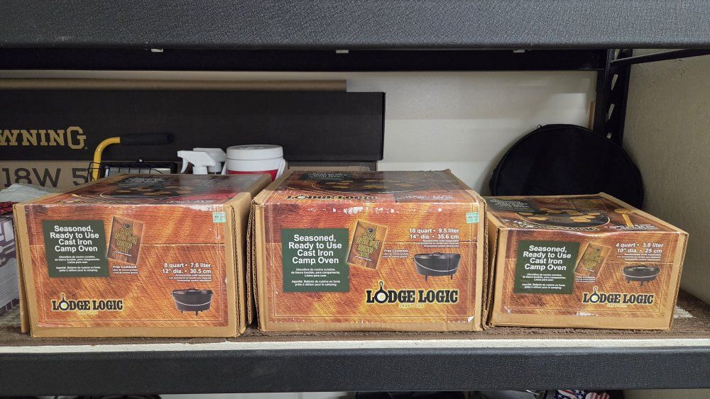 3 Lodge Cast Iron Camp Ovens in Box. Sizes #10 shallow, #12 Deep, #14 Deep.