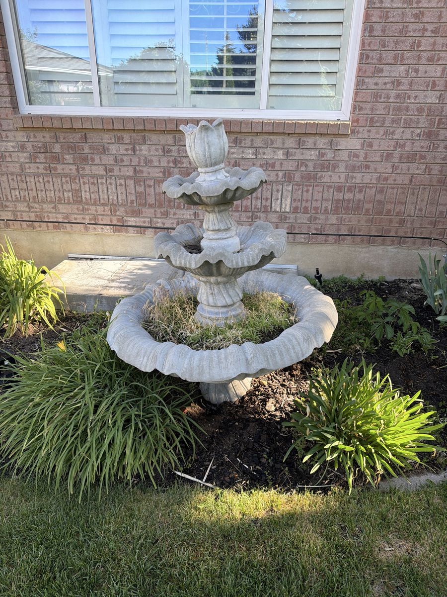 Two identical stone fountains