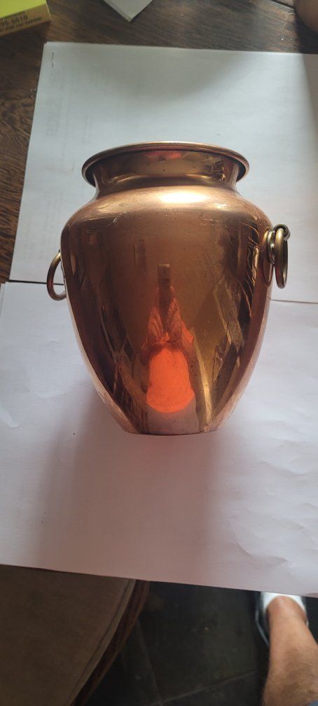copper vase 7 inches tall 6 inches at the widest part.