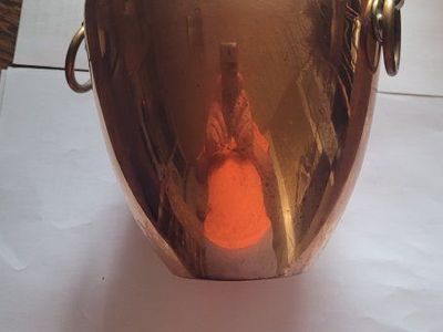 copper vase 7 inches tall 6 inches at the widest part.