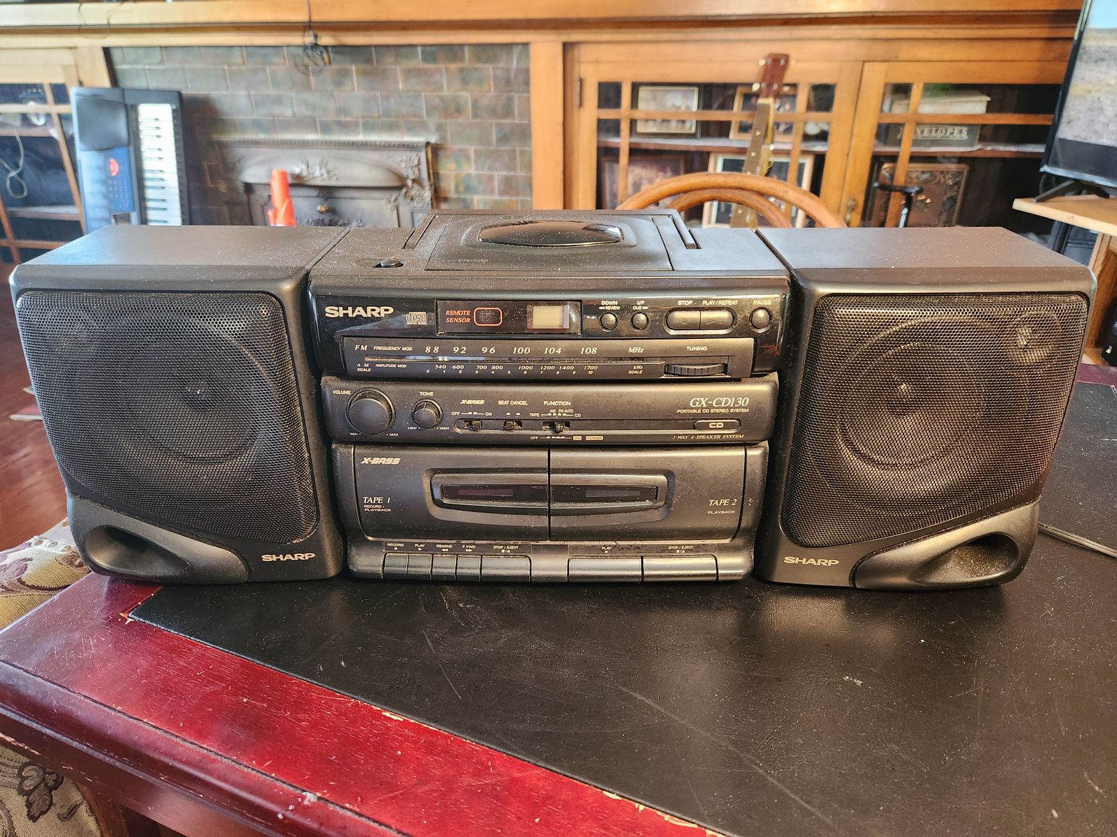 Sharp boom box with AM/FM, CD, and tape player.  Everything works perfect.  Has Bass boost...SOUNDS FANTASTIC.