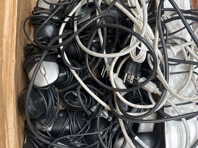 Box of computer mice and power supply cables
