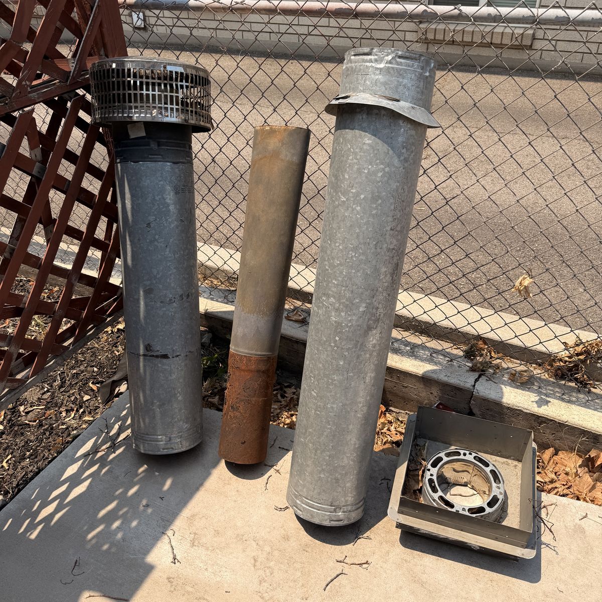 Used Galvanized and Rust Chimney/Flue Pipes with Vent Cap and Base