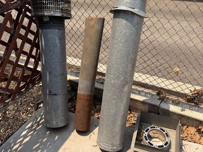 Used Galvanized and Rust Chimney/Flue Pipes with Vent Cap and Base