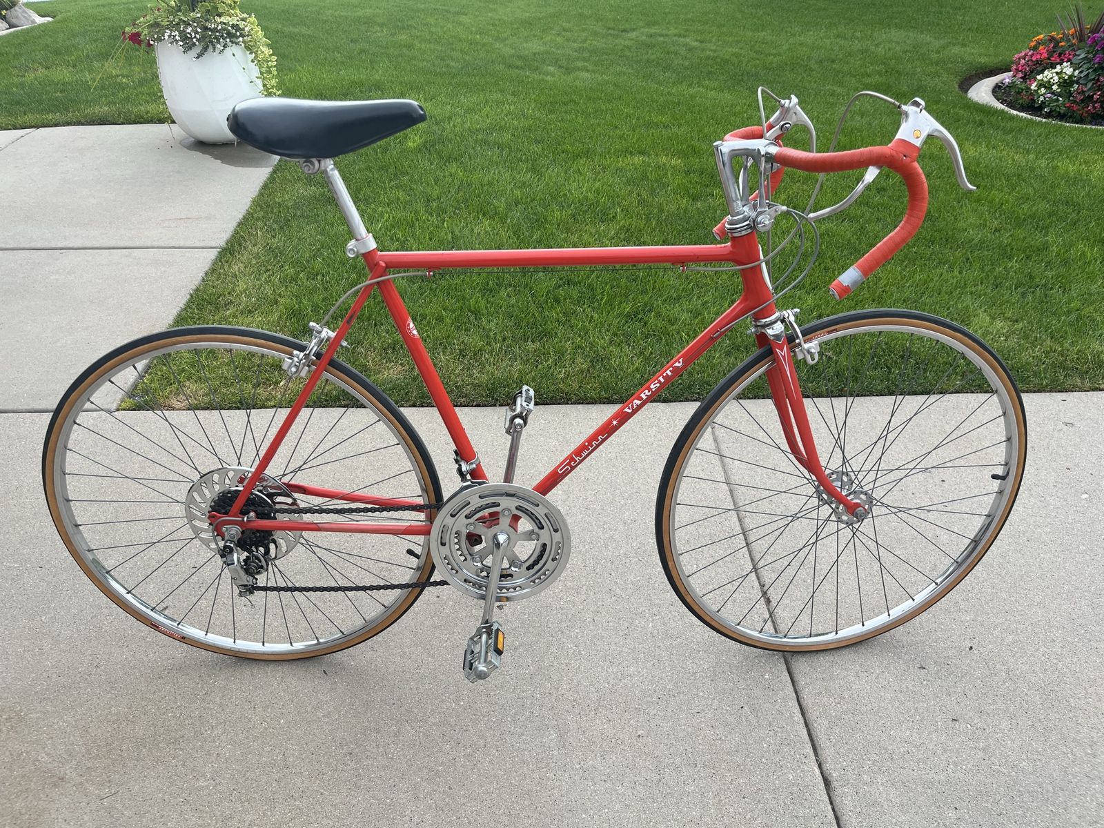 1973 Schwinn Varsity 10 speed in bright orange.