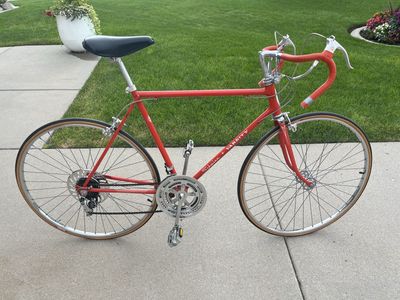 1973 Schwinn Varsity 10 speed in bright orange.
