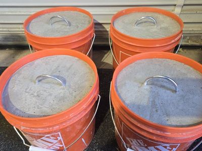 Concrete bucket tent weights