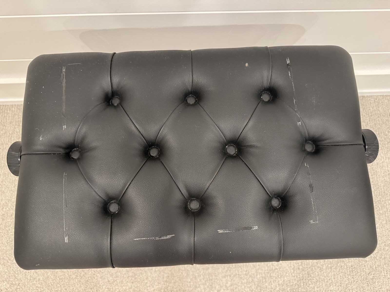 Black piano bench
