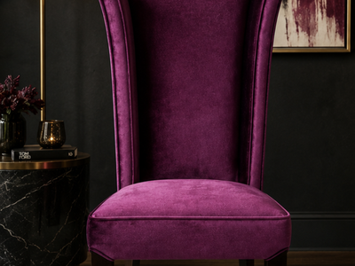 Make a statement with this luxurious plum velvet wingback accent chair.