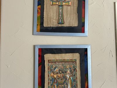 Set 2 framed Egyptian papyrus artworks featuring traditional ancient Egyptian designs.