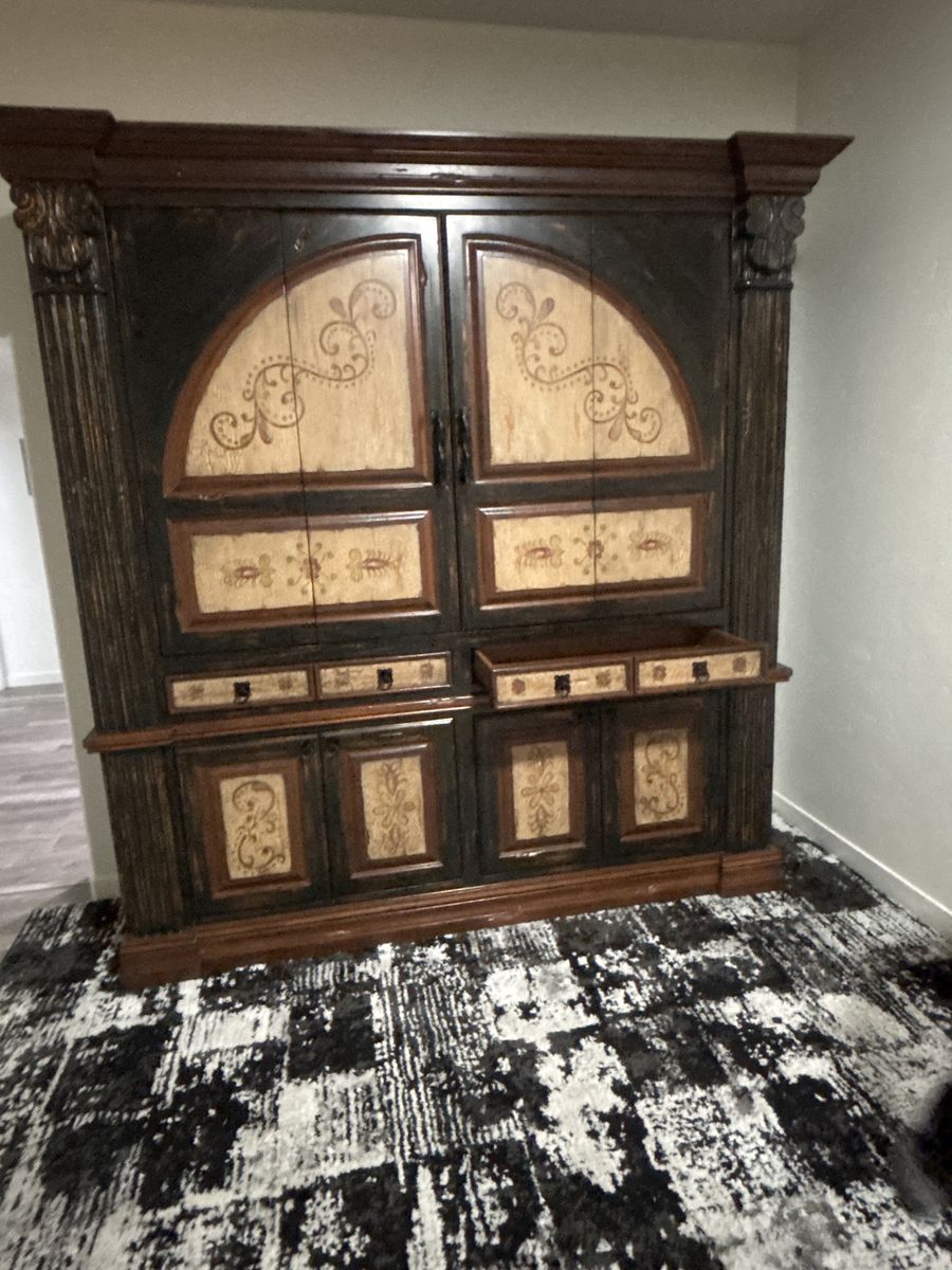 Ornate Dark Wood Armoire with Intricate Carvings and Light Accents - Storage Cabinet